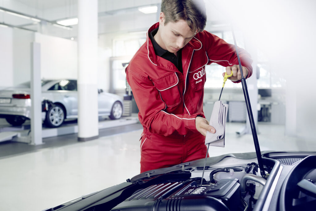 Audi mechanic working on car